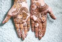 beautifully designed henna patterns on both hands